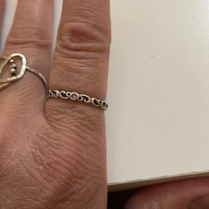 Pink sapphire water swirl eternity band